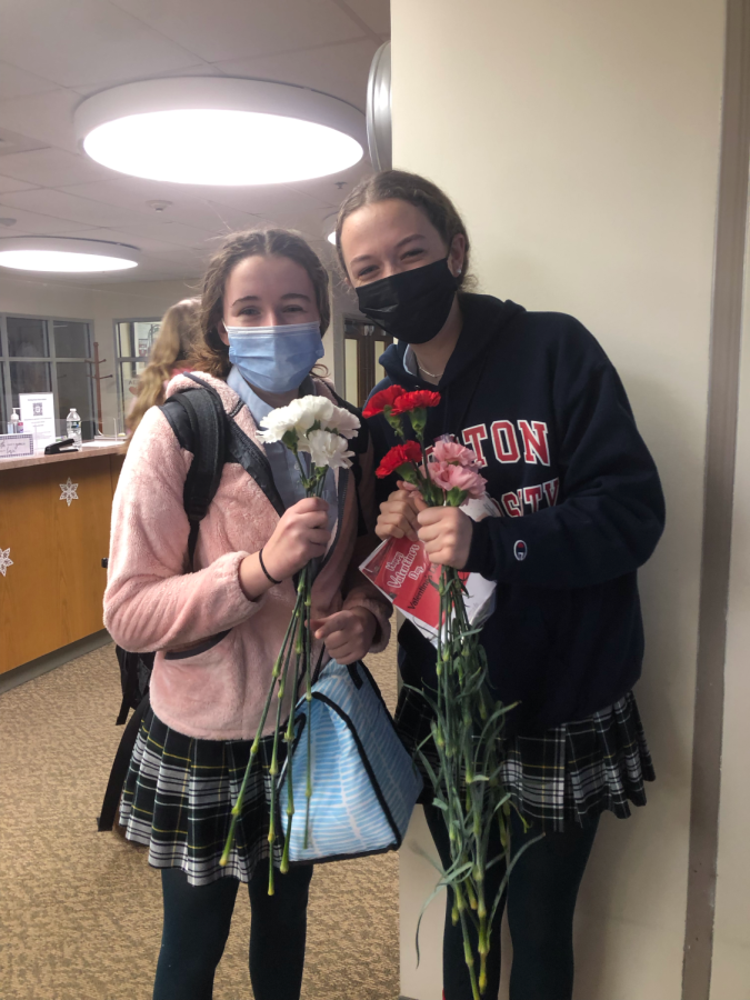 Pictured: Student Council members Molly Sullivan (left) and Ella O’Brien (right) before they go out to deliver the Carnations and Cards.
