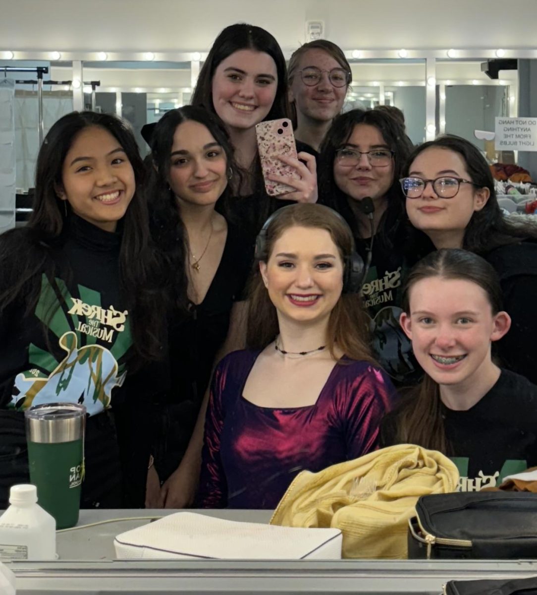 Jenna Packer ‘24 (center) with her costuming team. 