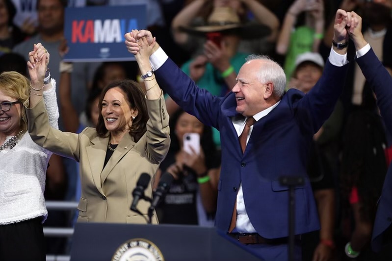 Vice President Kamala Harris (D-CA) and Governor Tim Walz (D-MN) cheer at a campaign rally in Glendale, Arizona.