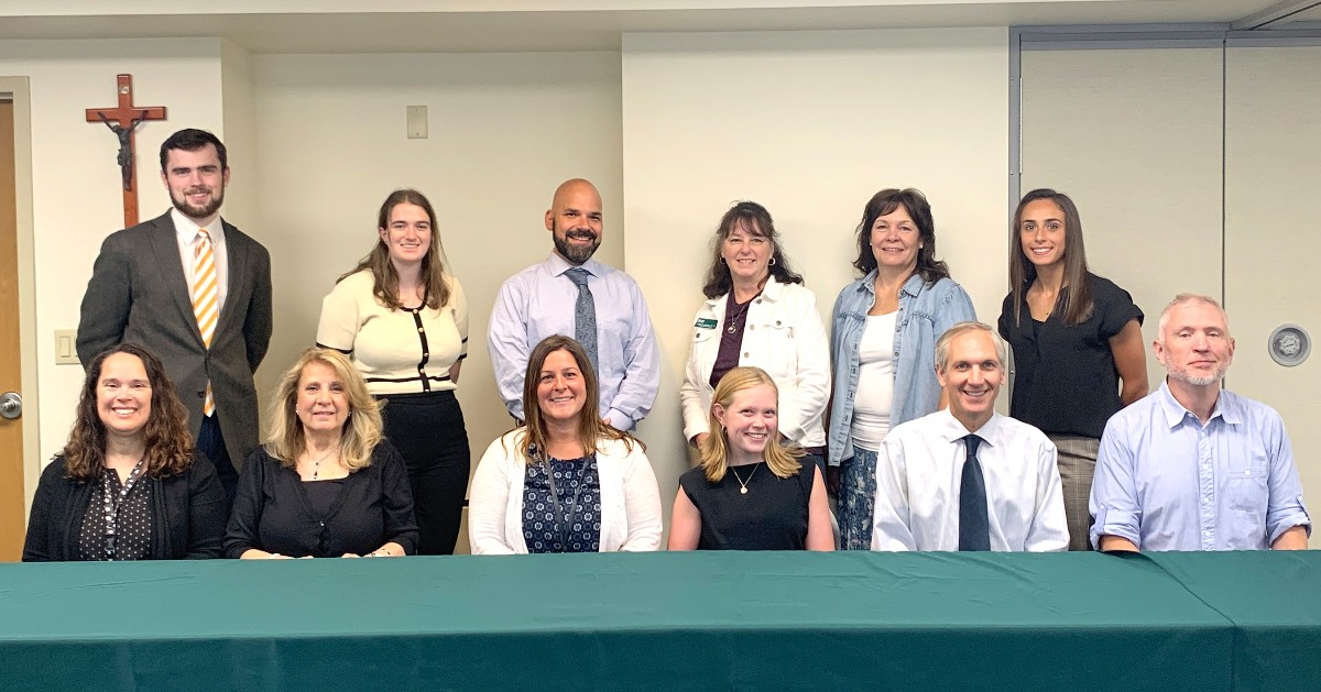 Front Row: Fatima Moura, Nancy Fisher, Denise Fay, Kathleen Hannon '20, Aaron Aguiar, James Pierce /



Back Row, L-R: Patrick McNamara, Camille Gallagher, Jason Deramo, Kathleen Bentley, Barbara Damaso, Hannah Ramer '20