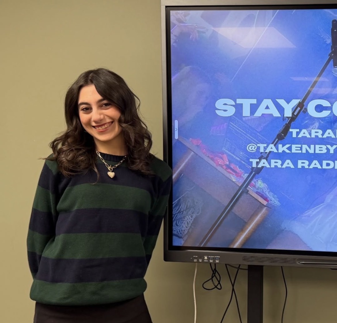 Tara Radmard ‘23 presenting her experience to the Photography Club.